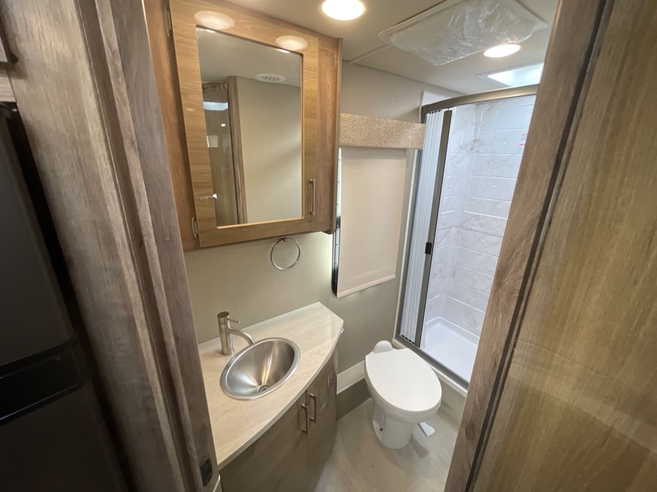 Entegra Coach QWEST 24 bathroom vanity, medicine cabinet, and toilet